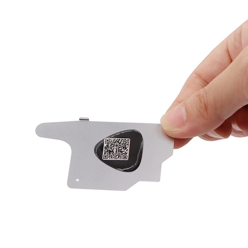 Hand holding the tip of the 3D Stainless Steel Screen Dismantling Tool, with the back of the tool visible, highlighting its sleek and durable design