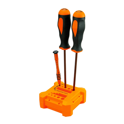 JM-X3 Small Screwdriver Magnetizer & Demagnetizer Tool on a table with three screwdrivers inserted, demonstrating its ability to magnetize and demagnetize tools