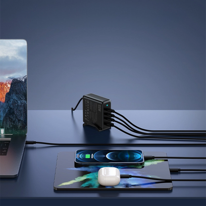 PD100W GaN Multi-Port Charger for Laptops & Phones, black variant in an angled view on a table, with an iPhone, iPad, AirPods, and laptop charging