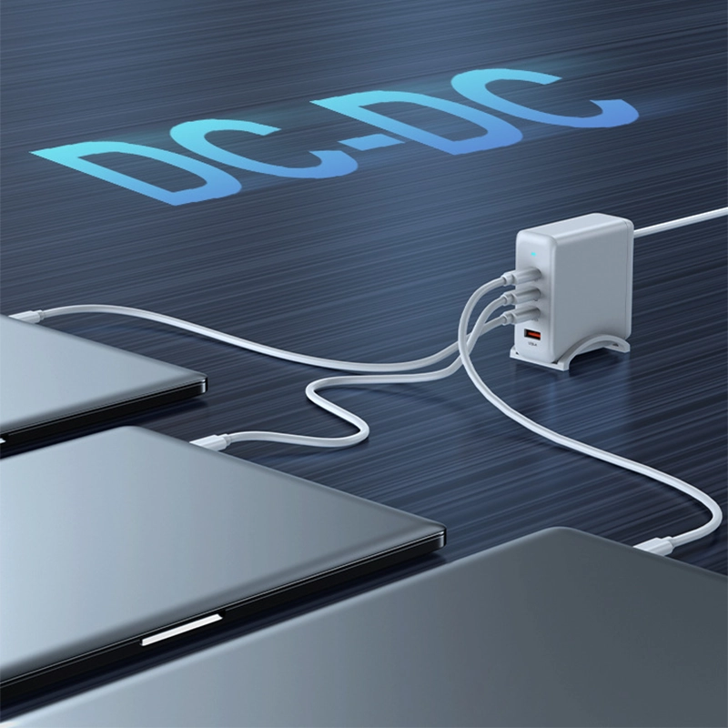PD100W GaN Multi-Port Charger for Laptops & Phones, white variant charging three laptops simultaneously on a dark blue surface