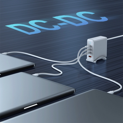 PD100W GaN Multi-Port Charger for Laptops & Phones, white variant charging three laptops simultaneously on a dark blue surface